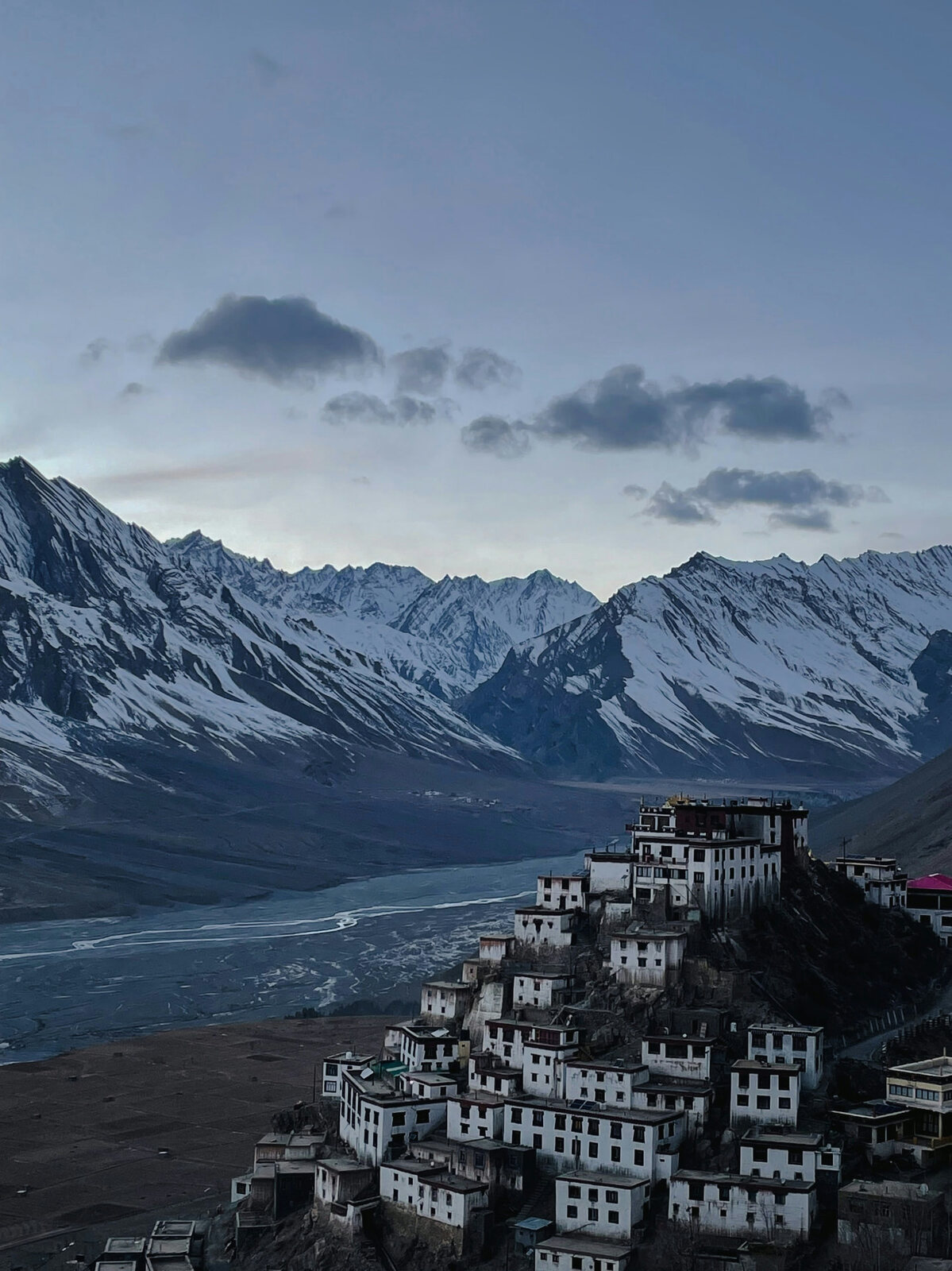 Key Monastery below snow-capped peaks in Spiti Valley